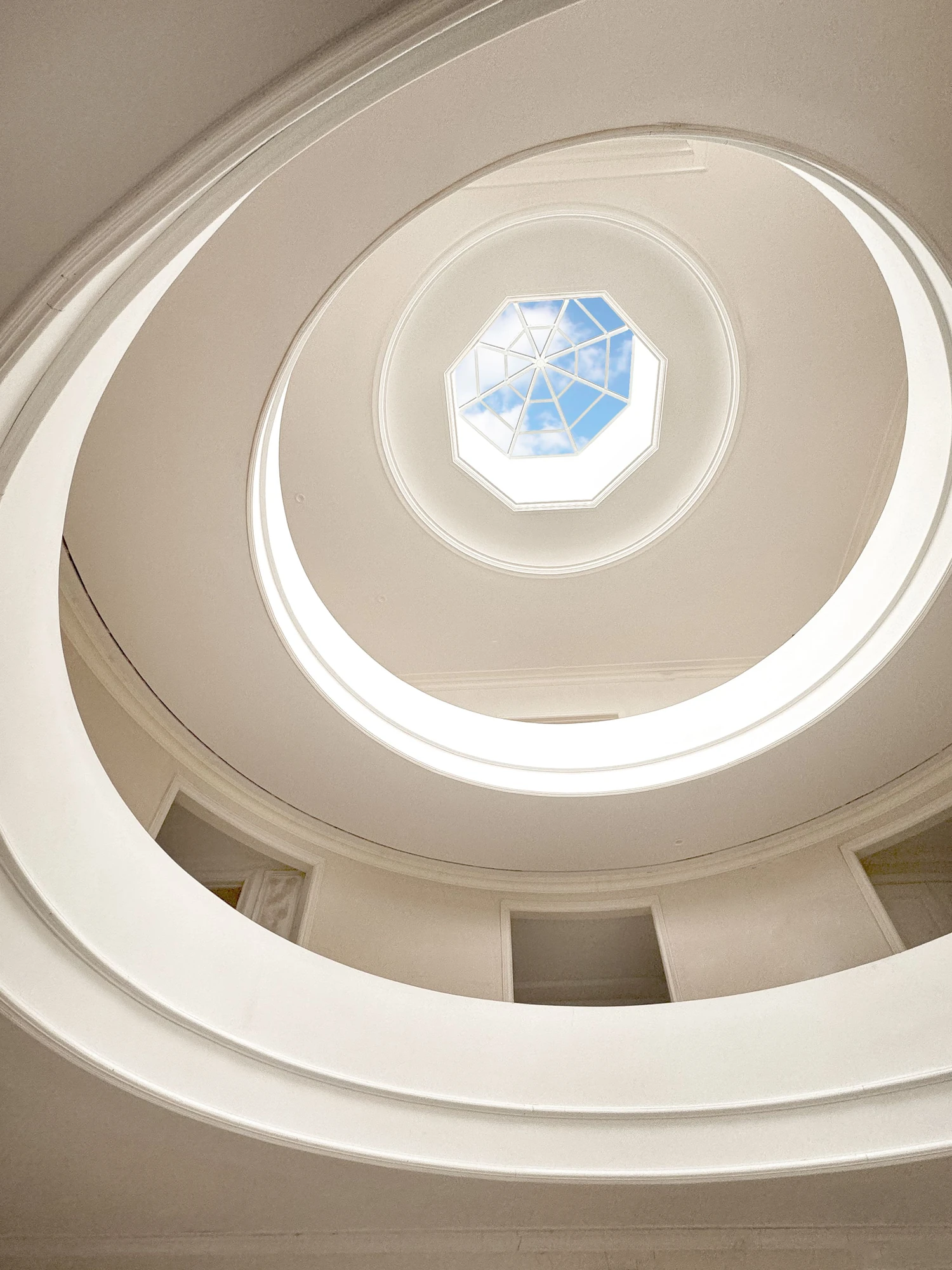Upward view through the circular atrium toward its octagonal skylight at 5040 Independence Avenue