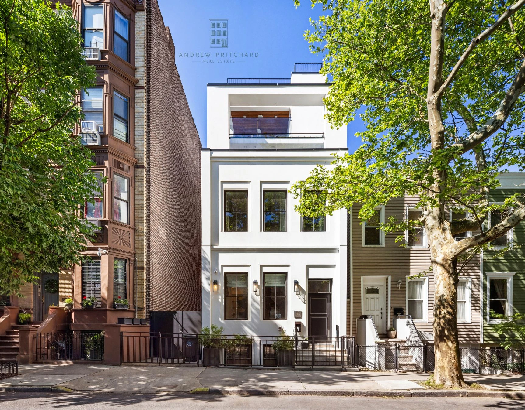 Freestanding white modern townhouse at 232 Eighth Street in Park Slope