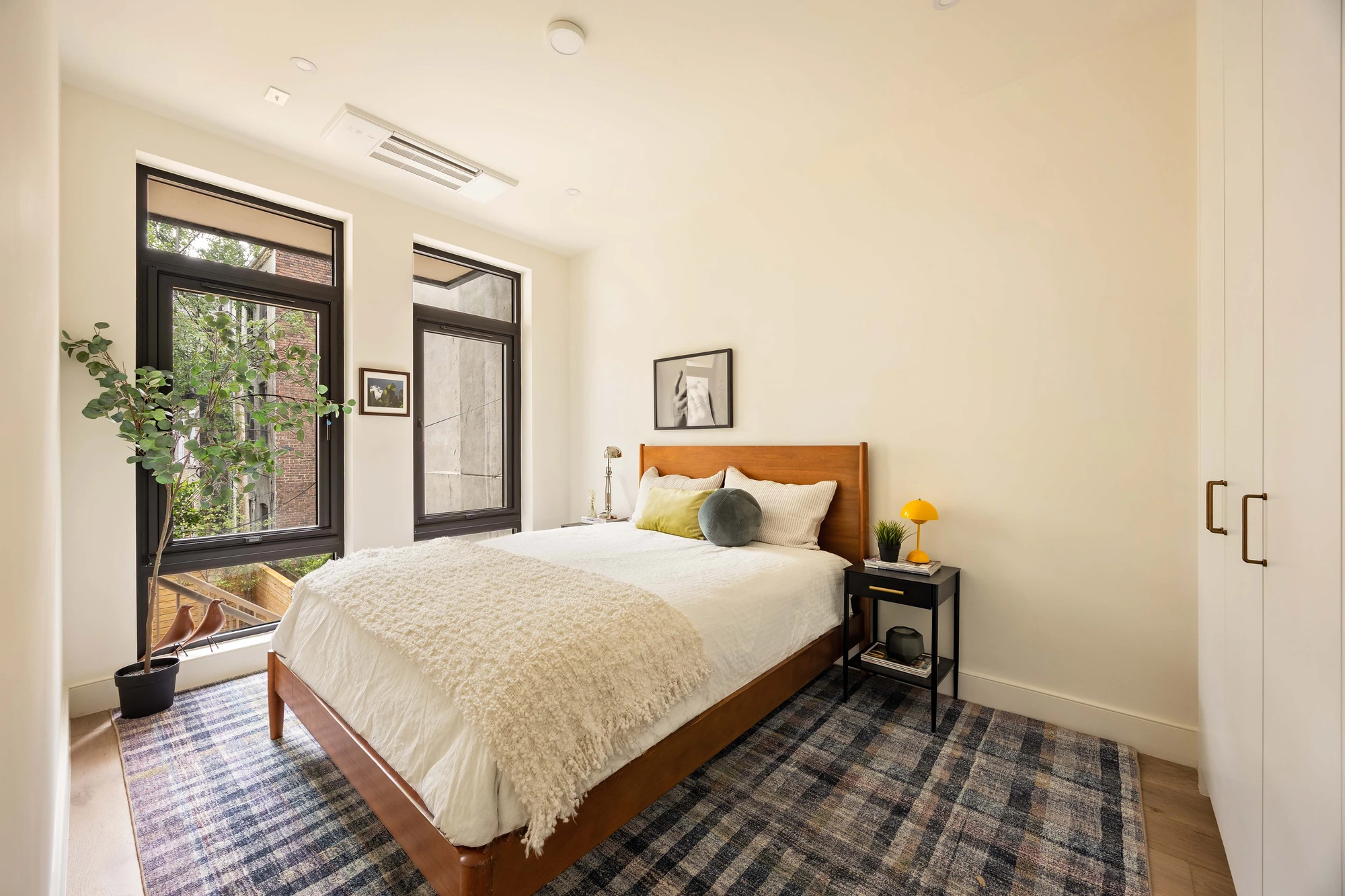 Bedroom with black-framed windows at 269 Bainbridge Street