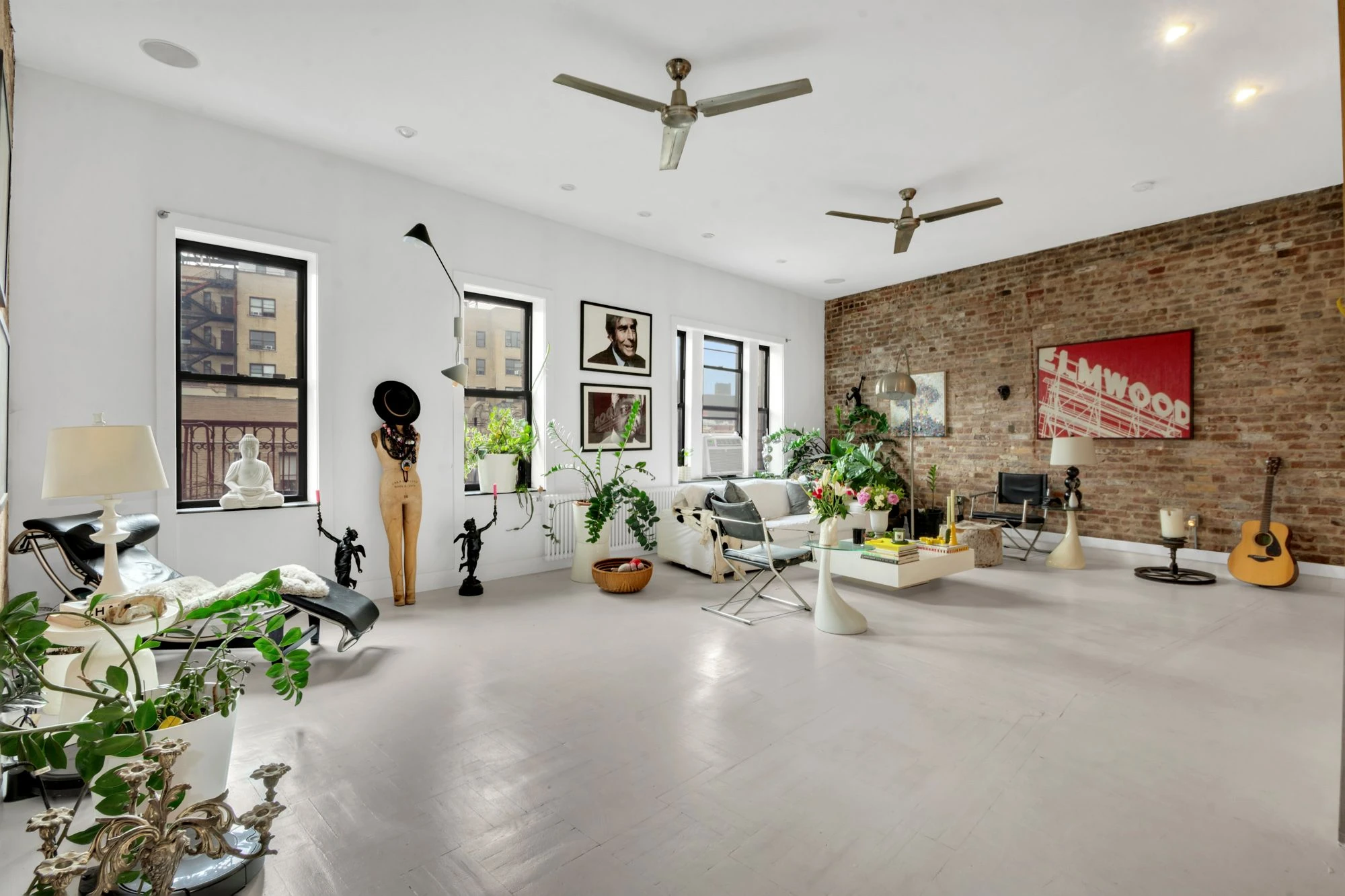 Loft-like living room with exposed brick at 47 Fort Washington Avenue