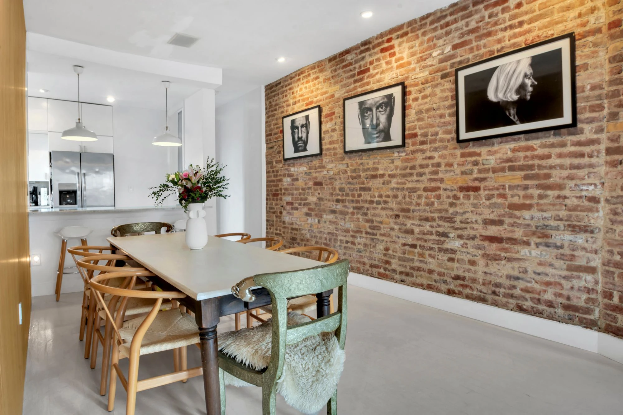 Dining area beside exposed brick at 47 Fort Washington Avenue