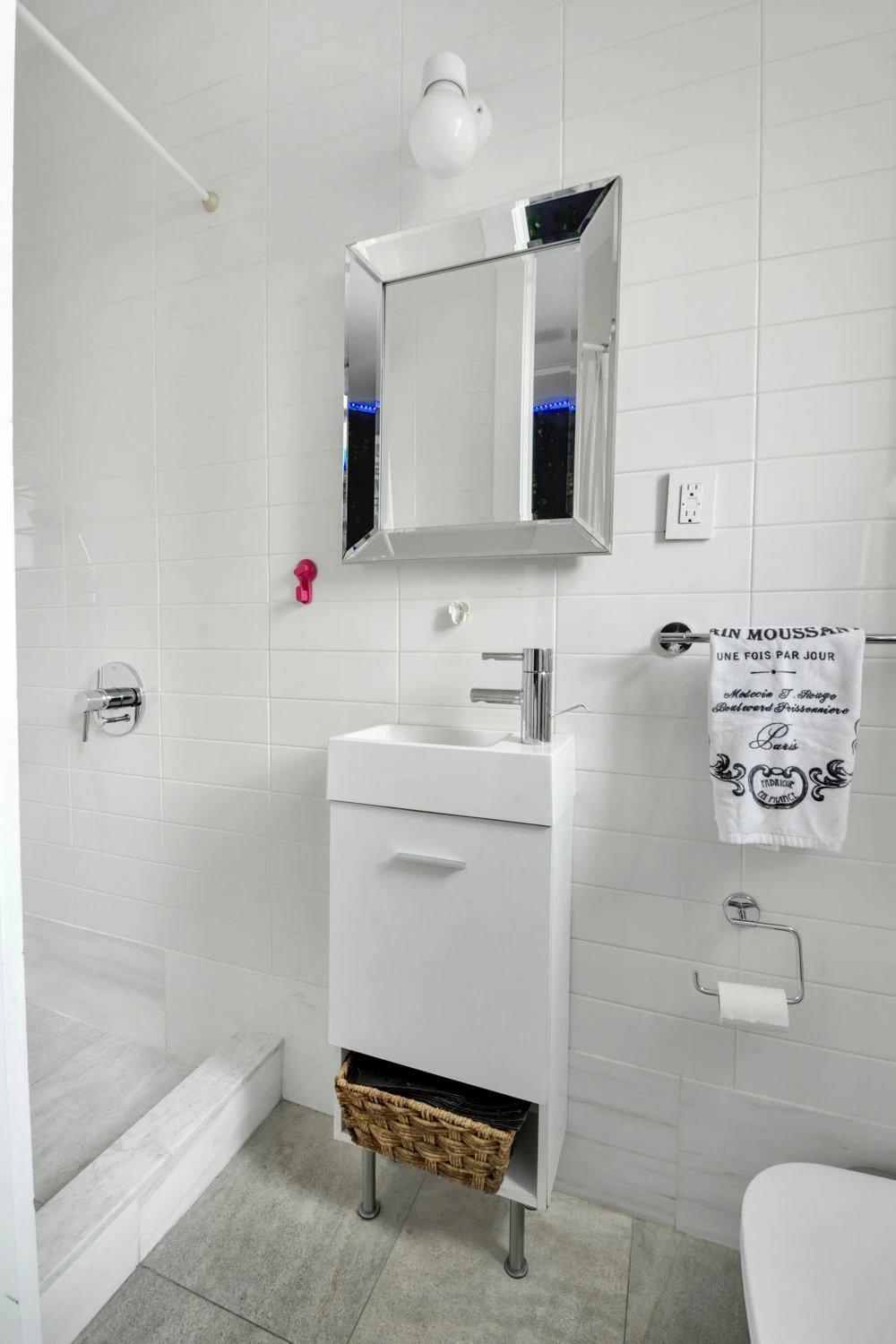White bathroom with floating vanity at 47 Fort Washington Avenue