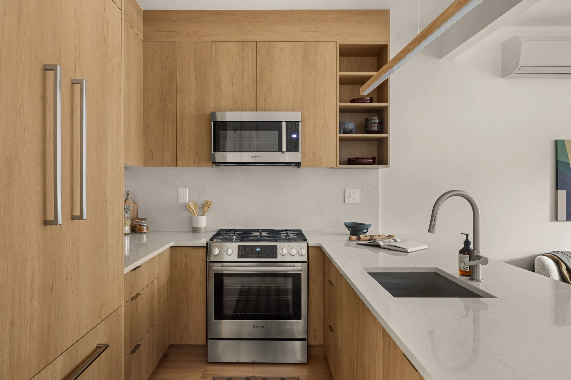 Kitchen with white quartz counters at 1230 Putnam Avenue