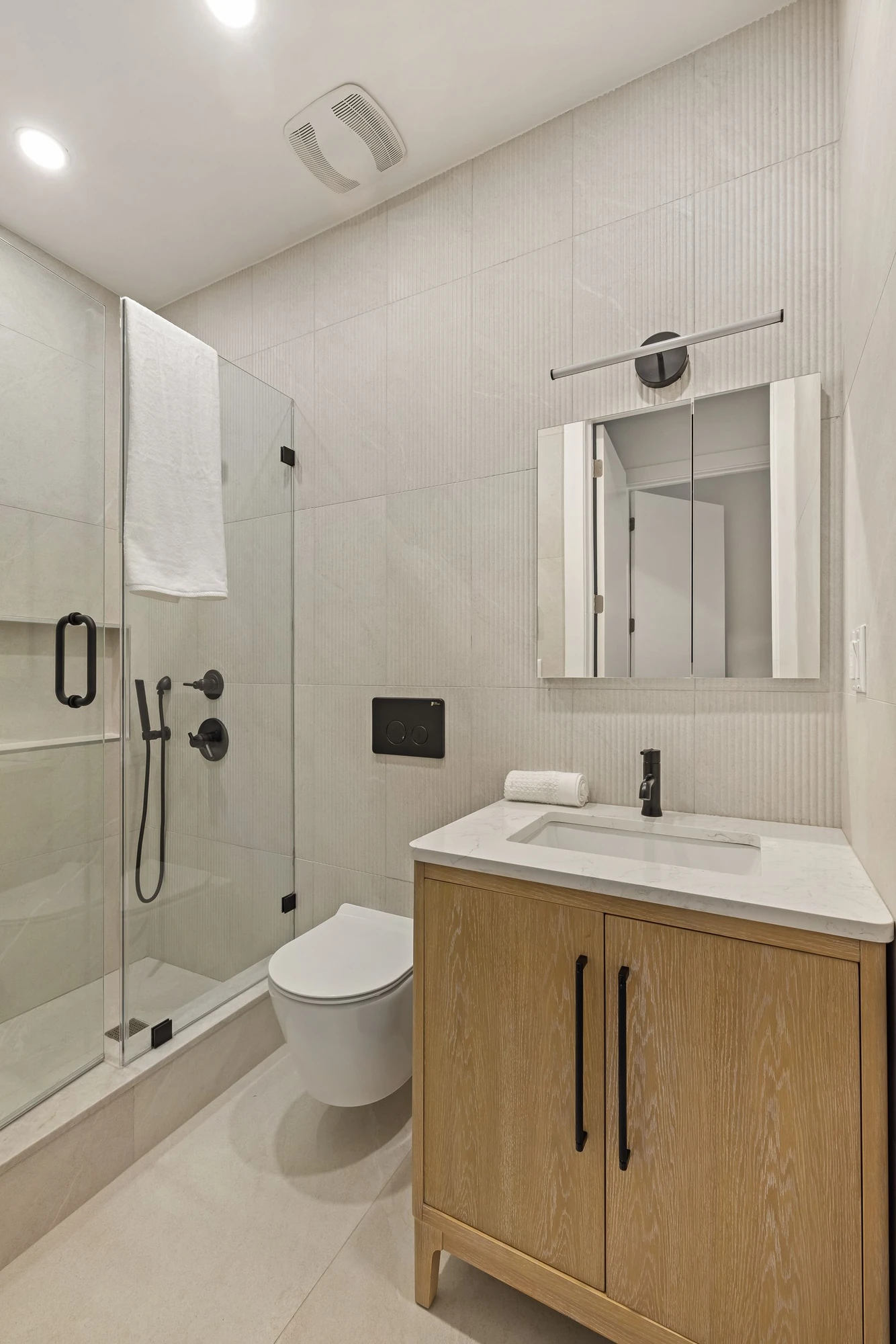Fluted tile bathroom at 1230 Putnam Avenue