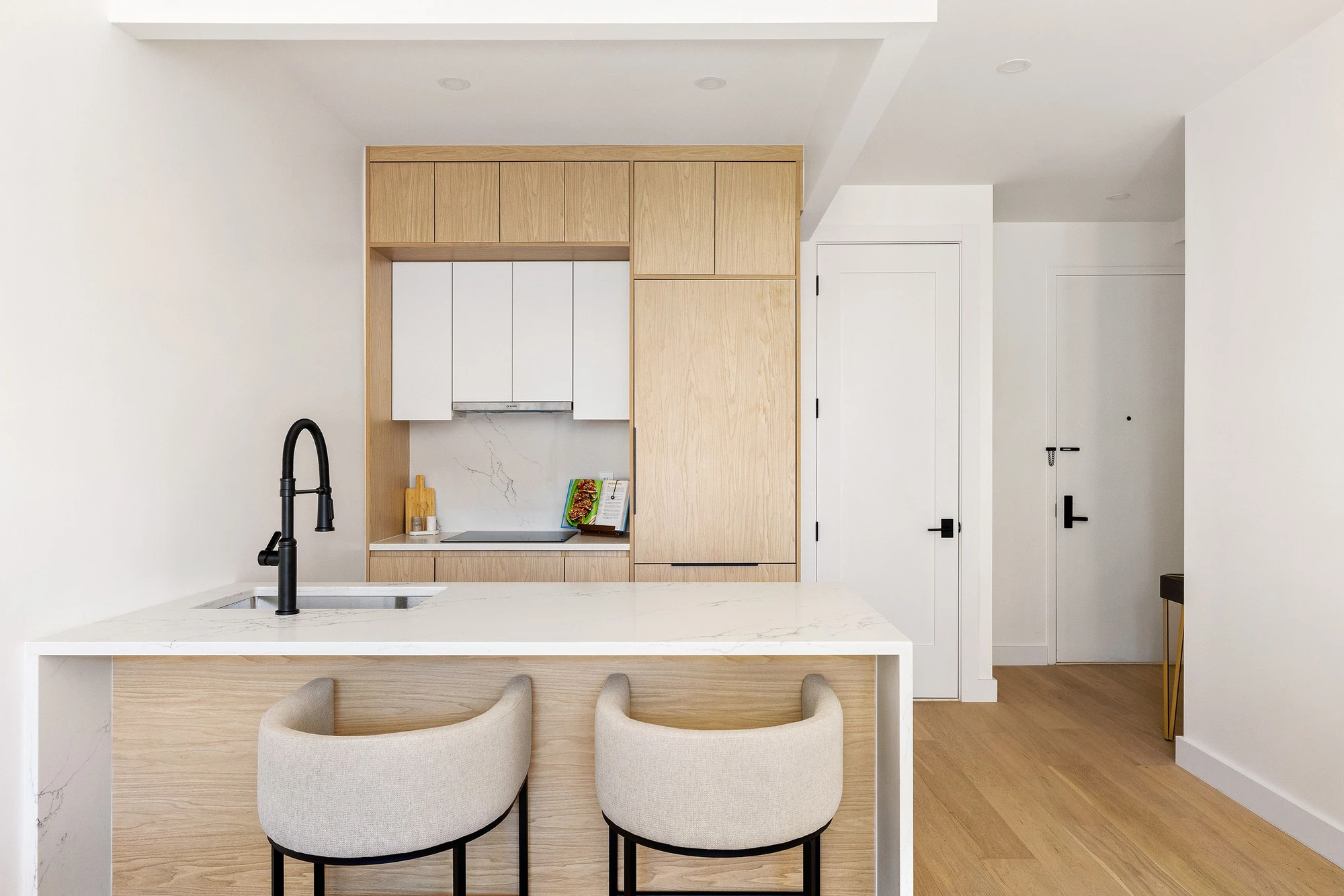 Light-wood kitchen cabinetry at 301 Stockholm Street