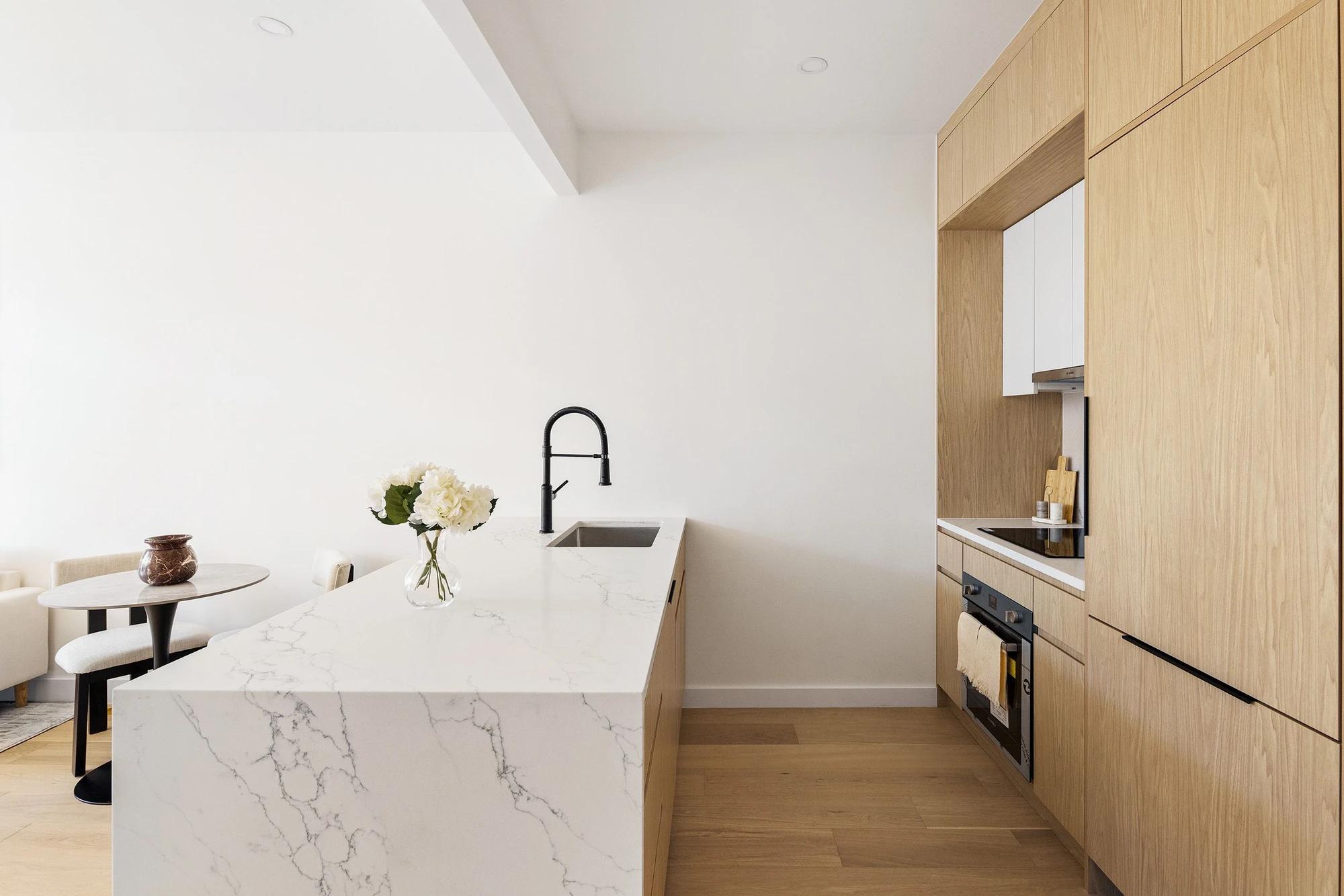 Kitchen with a marble waterfall island at 301 Stockholm Street