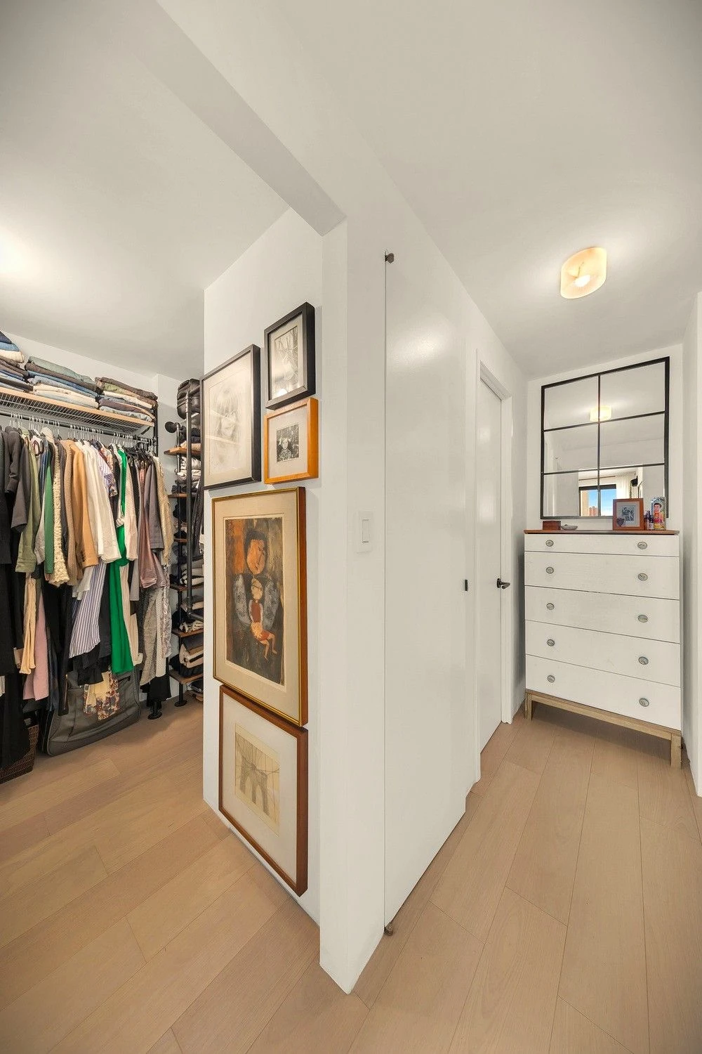 Walk-in closet beside the bedroom entrance at 90 Gold Street #21F