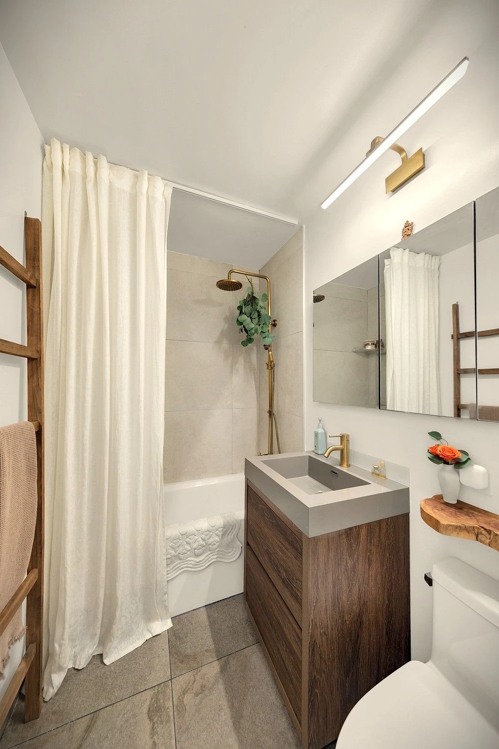 Bathroom vanity and tub at 90 Gold Street #21F