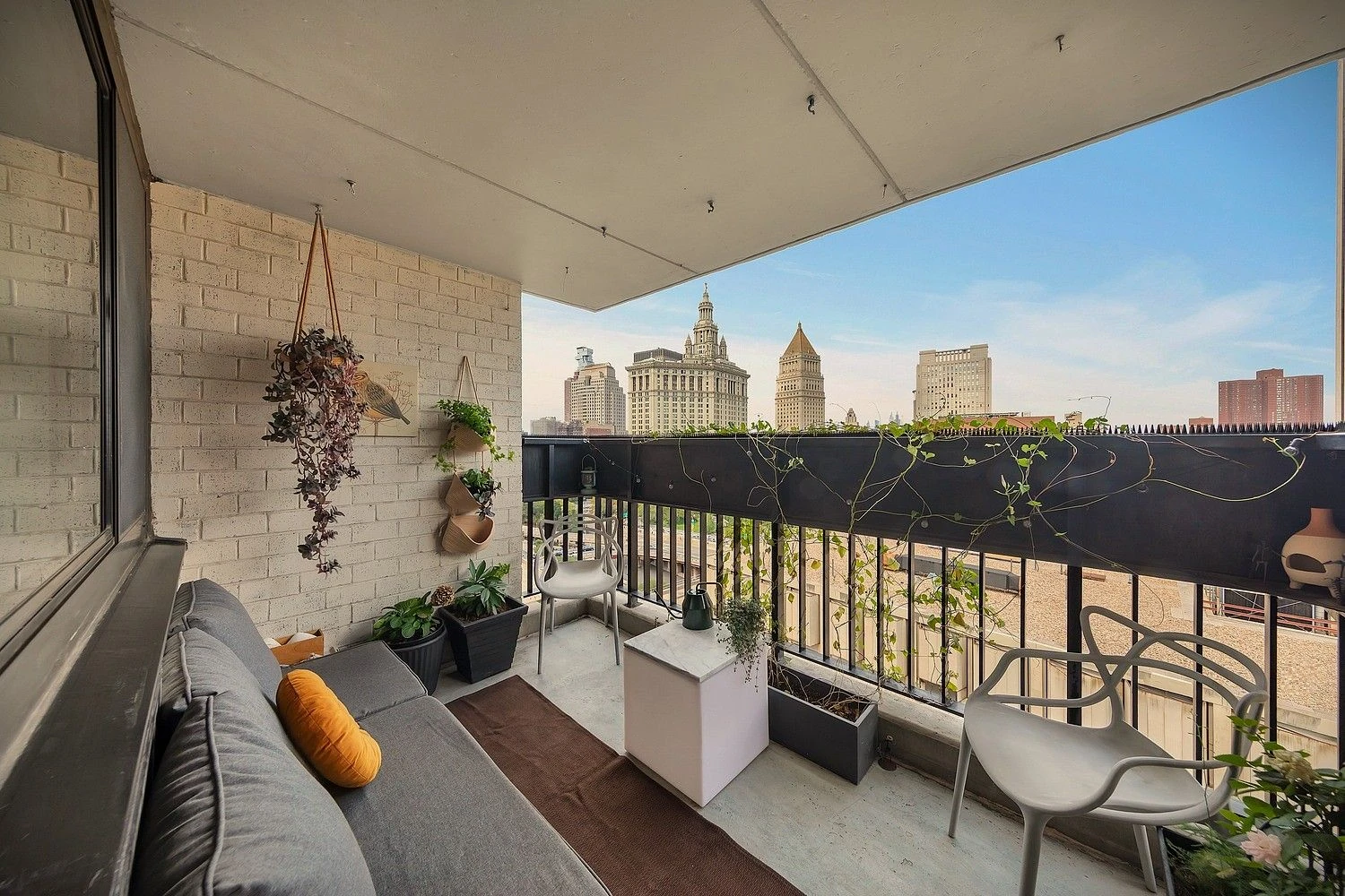 Seating on the private balcony at 90 Gold Street #21F
