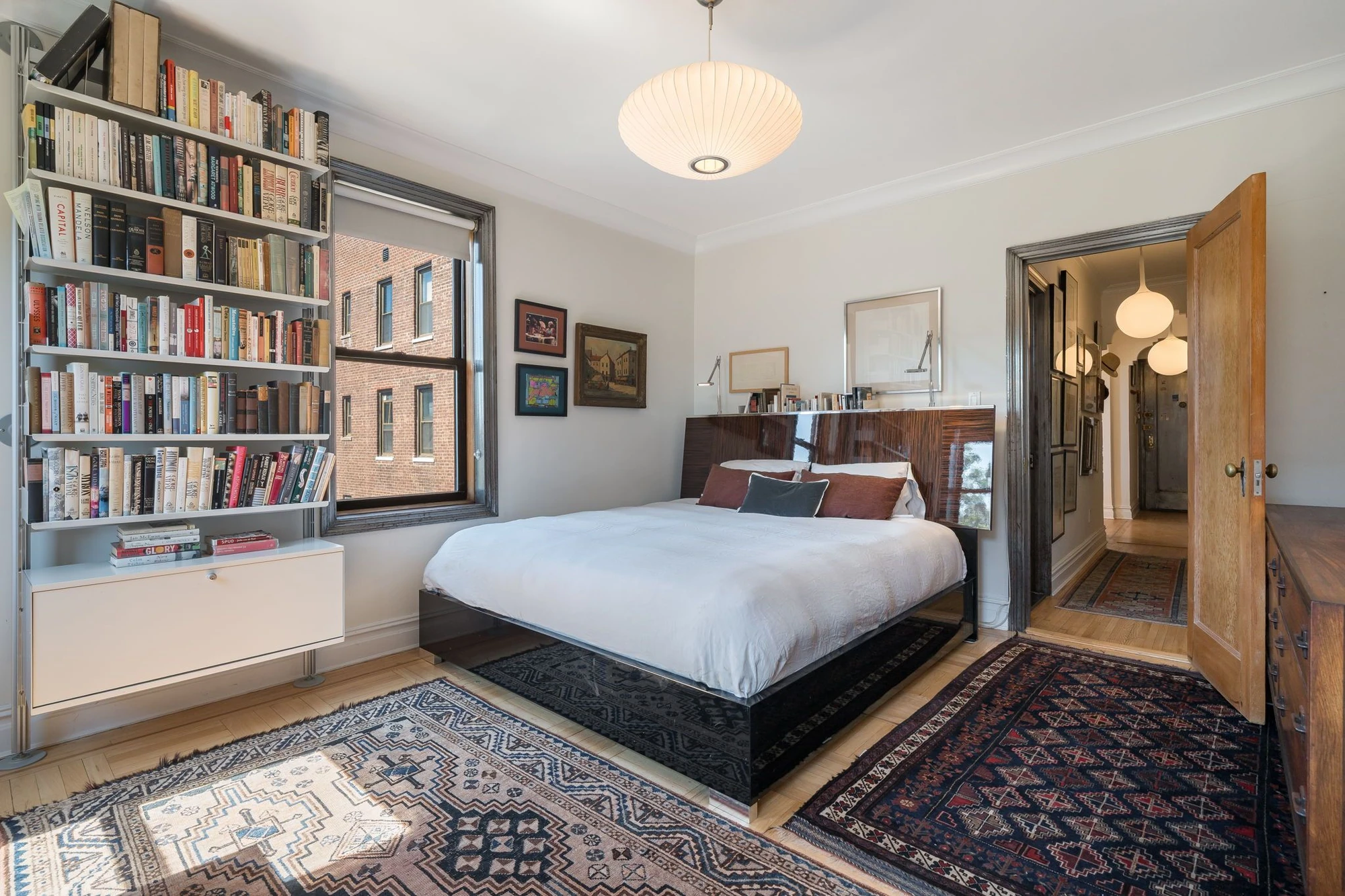Bedroom with shelving beside the bed at 1710 Avenue H #C5