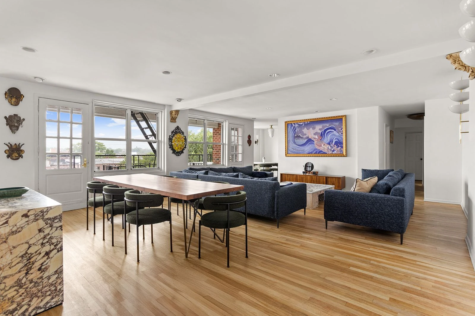 Living and dining area viewed from the kitchen at 34-43 60th Street #4DE