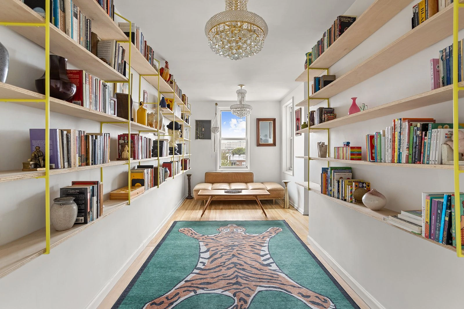Separate office/library lined with bookshelves at 34-43 60th Street #4DE