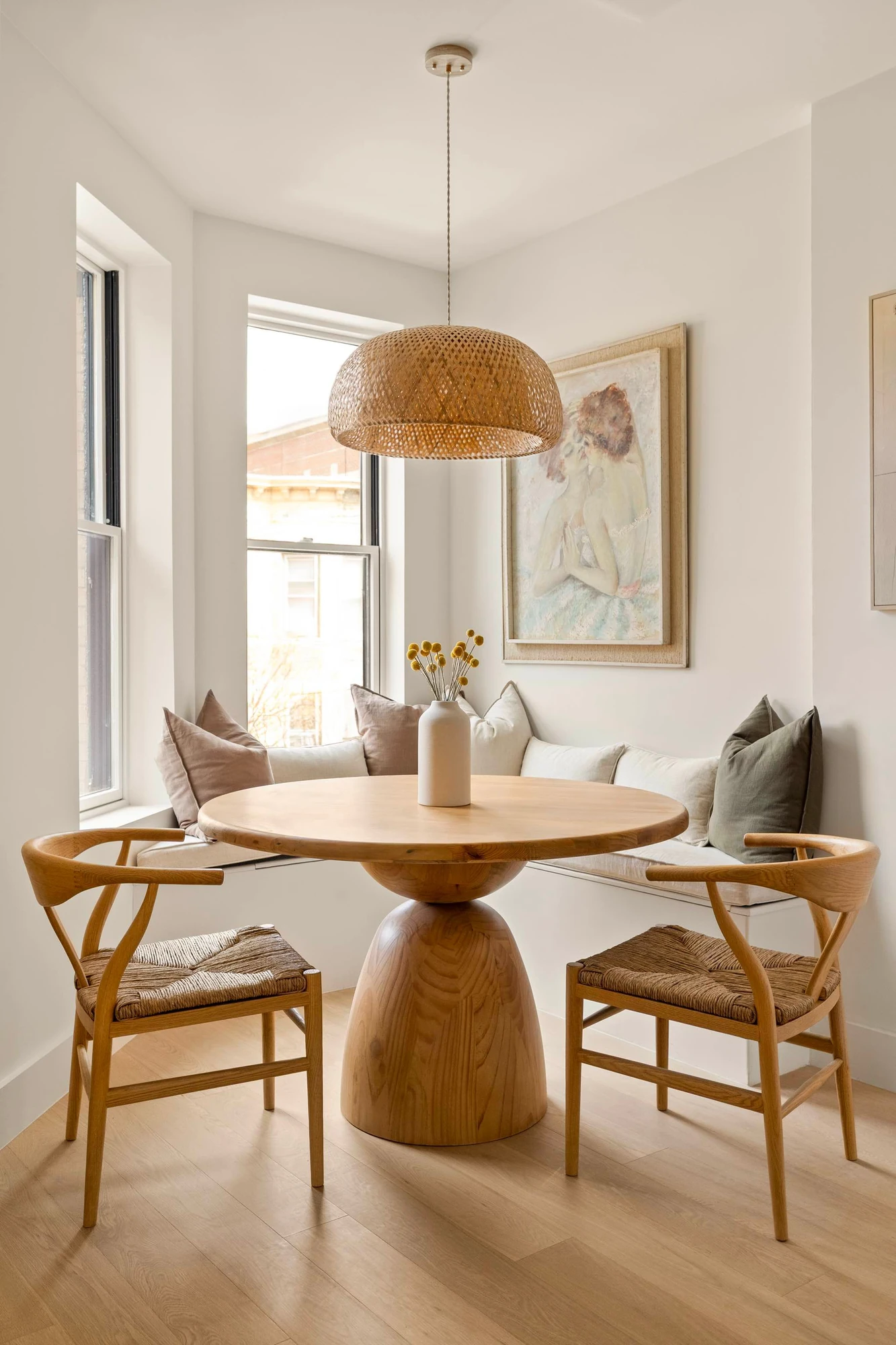 Dining table with built-in seating beside the kitchen at 60-64 Catalpa Avenue #2A