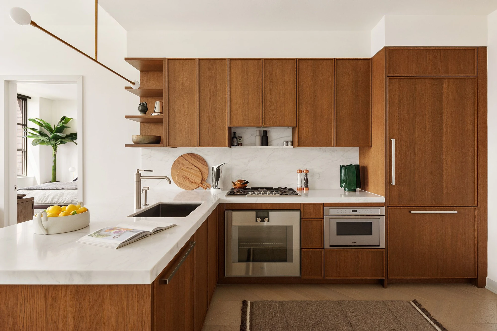 Broker-supplied kitchen image with oak cabinetry and a pale counter; exact-unit photo or rendering attribution unconfirmed at 115 York Street #4A–York