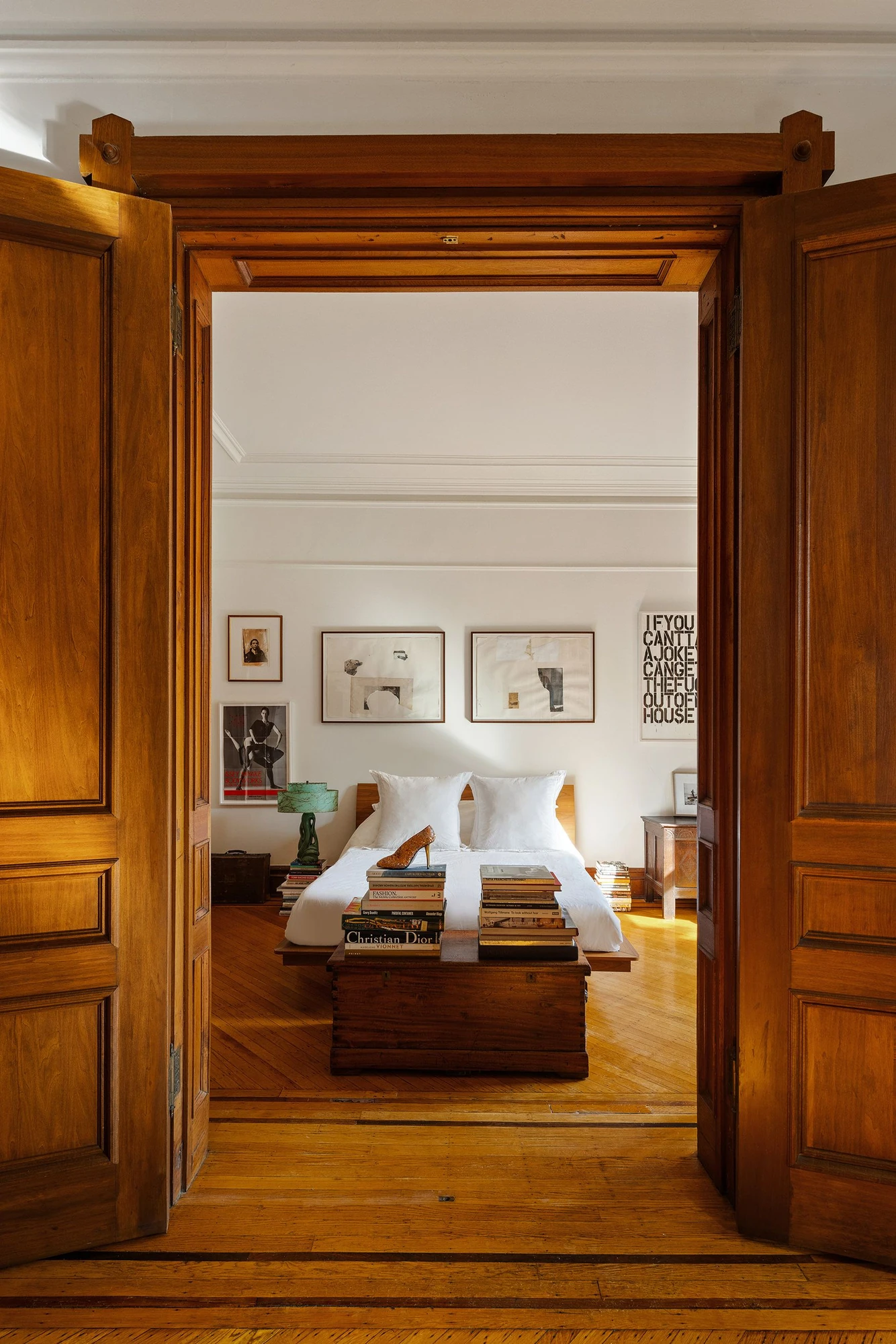 Large wood pocket doors connecting the living room and bedroom at 39 Remsen Street #4A