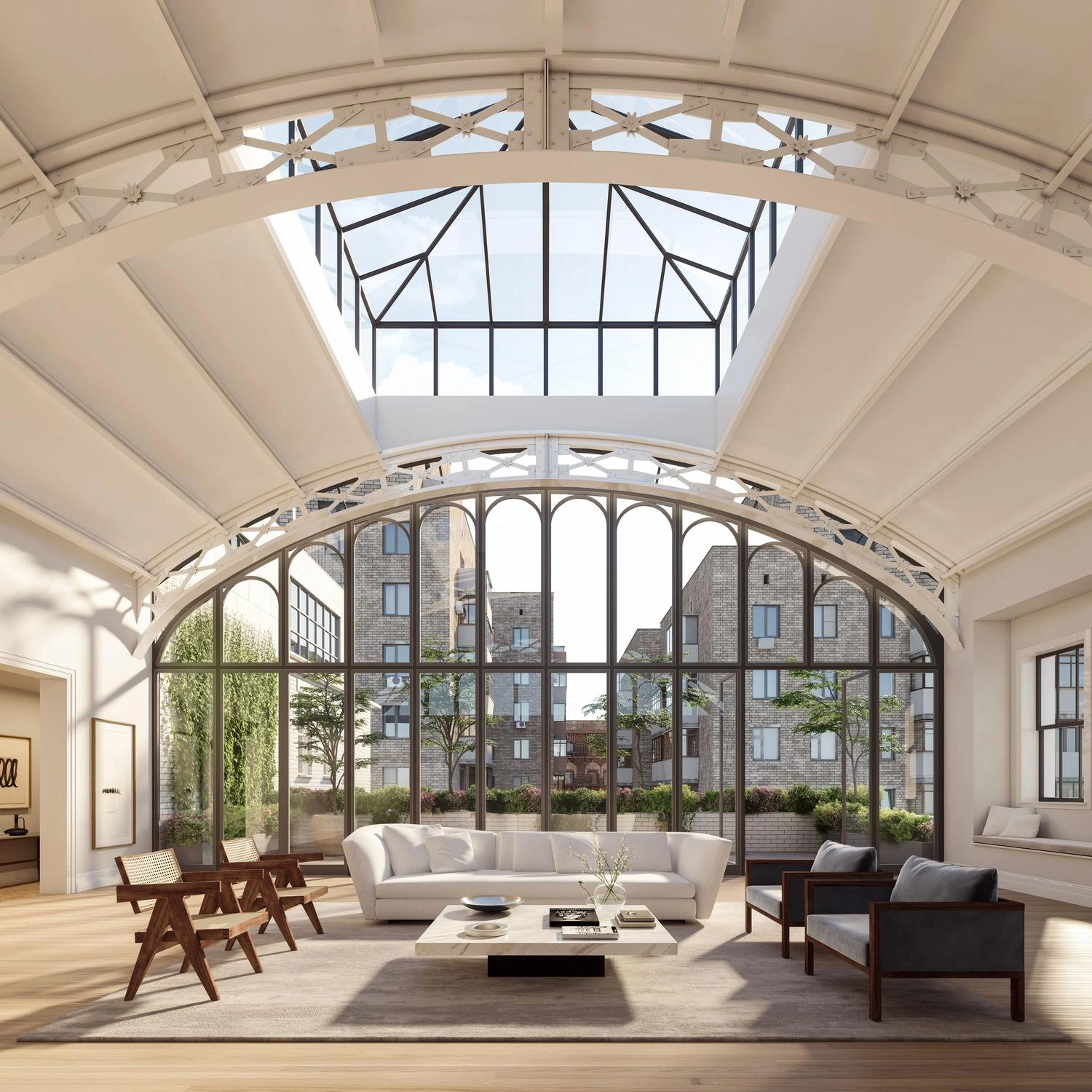 Solarium Penthouse great room with arched windows, exposed metal trusses, and a vaulted ceiling